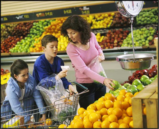 Mom and kids in the produce aisle of the store