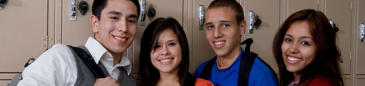 Hispanic teens smiling at camera