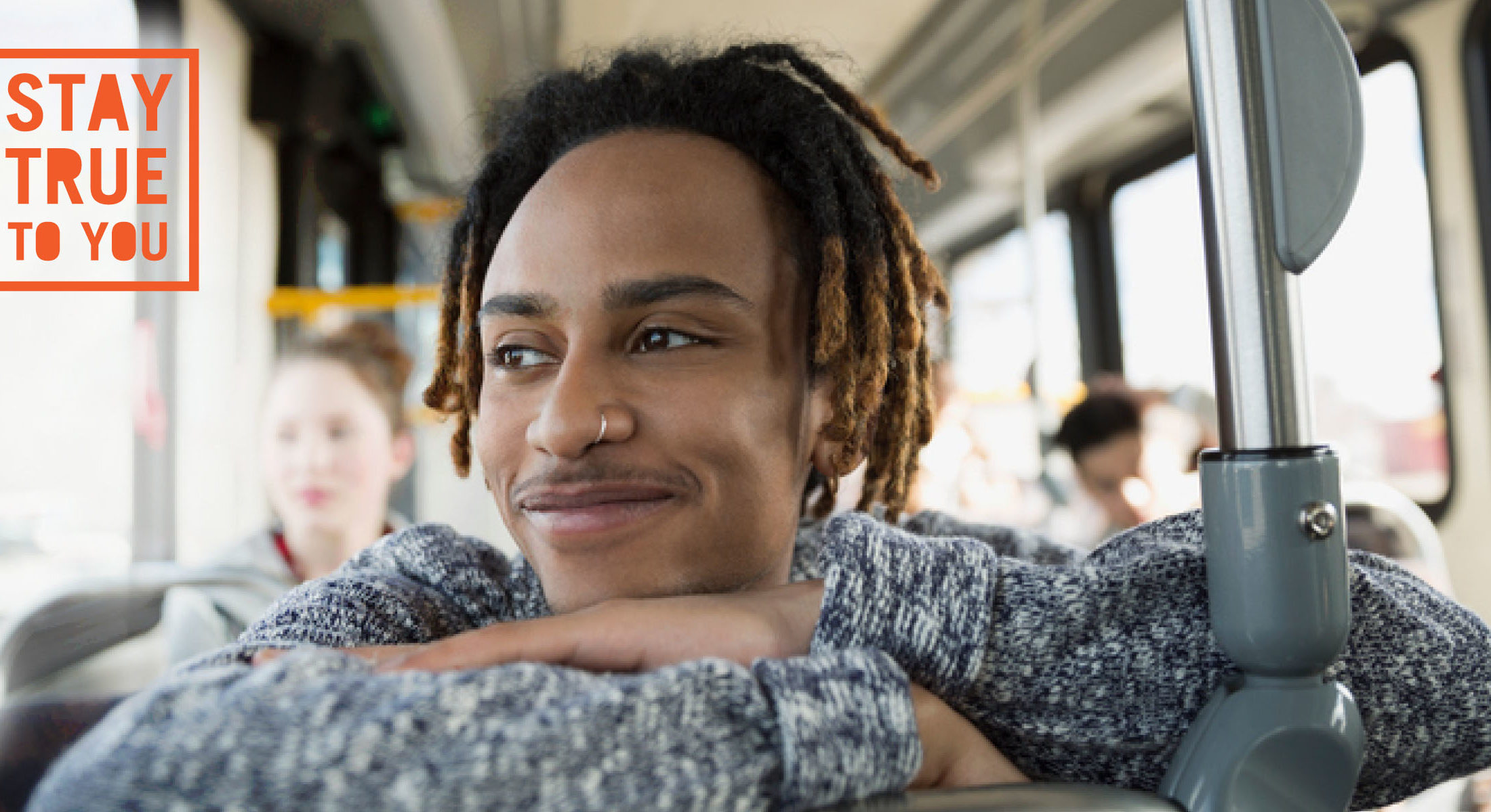 Black teen with nose ring in bus looking out window smiling Stay True To You