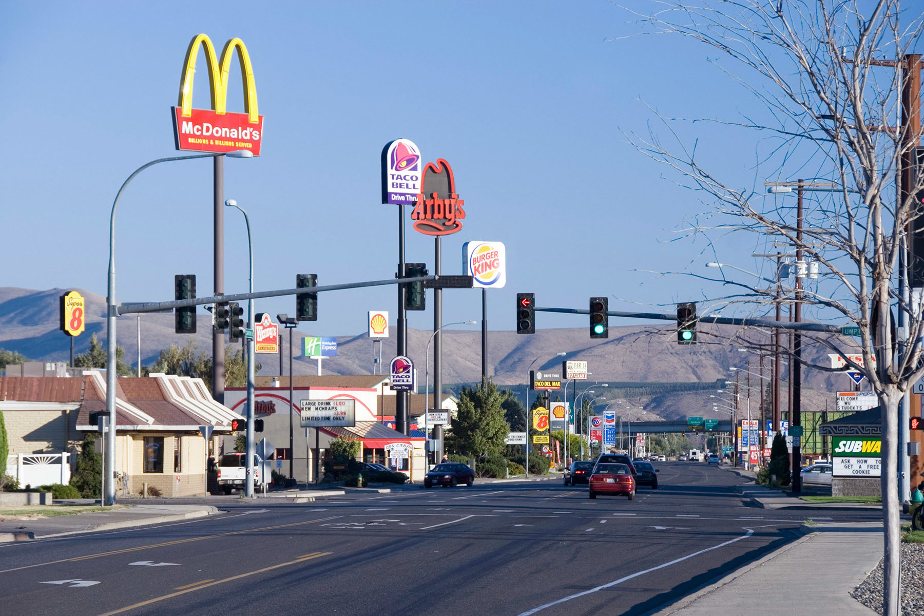 Street full of fast food restaurants such as McDonald's, Taco Bell, Arby's and Burger King